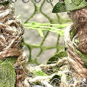 Made a basket nest he hangs upside down above it like a bat